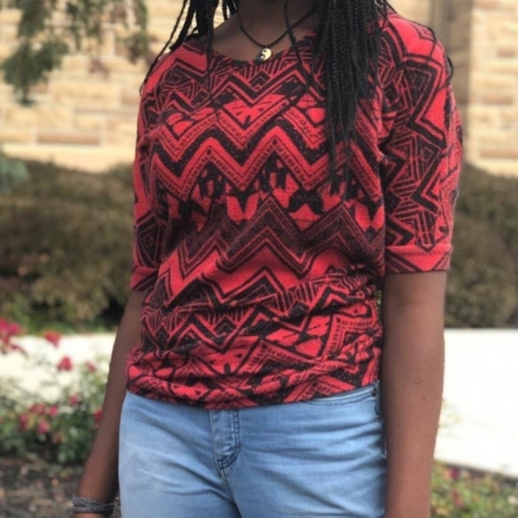 A red and black patterned shirt - Picture 2 of 3